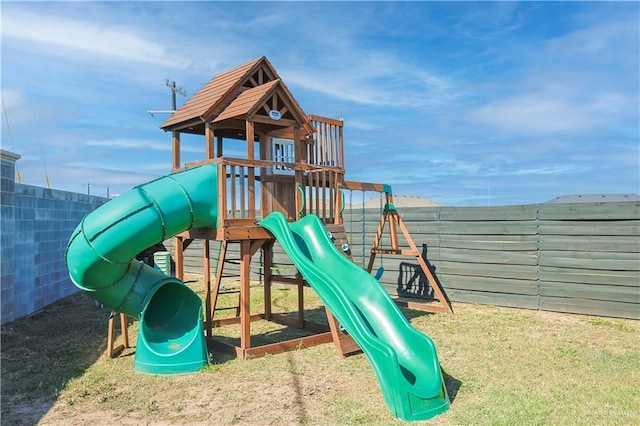 view of playground featuring fence