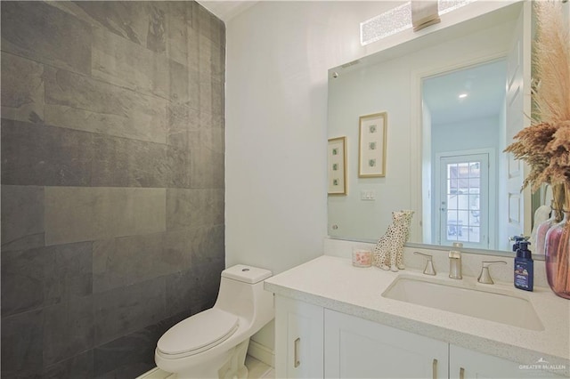 bathroom with vanity and toilet