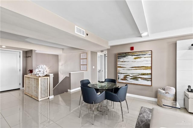 dining space featuring light tile patterned floors