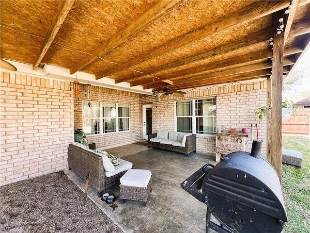 view of patio / terrace featuring ceiling fan, an outdoor living space, and grilling area