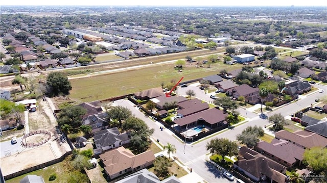 birds eye view of property with a residential view