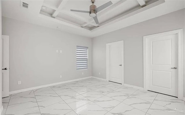 unfurnished bedroom with coffered ceiling, beam ceiling, and ceiling fan