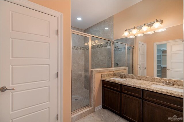 bathroom with vanity and an enclosed shower