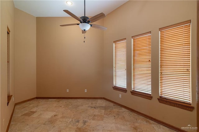 spare room featuring ceiling fan and lofted ceiling