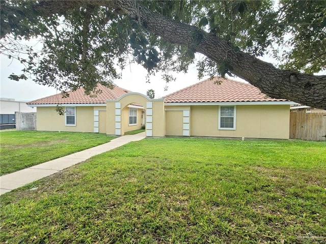 105 S Ridge Ln, San Juan, TX 78589 - rear view of property featuring stucco siding and a tile roof