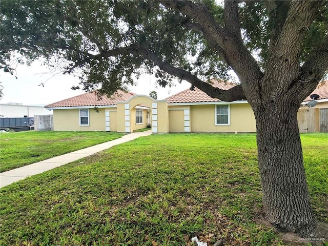 105 S Ridge Ln, San Juan, TX 78589 - view of front facade with stucco siding and a tiled roof