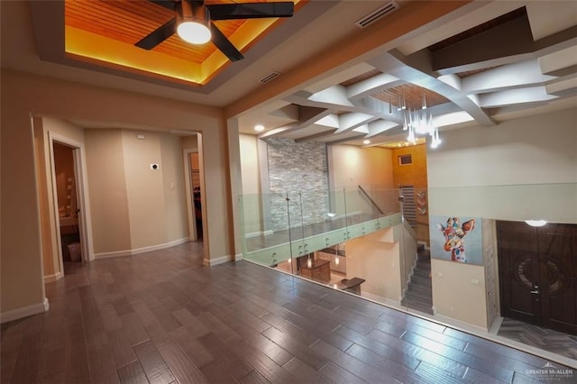 living room with ceiling fan and dark wood-type flooring