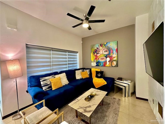 living room with ceiling fan and light tile patterned floors