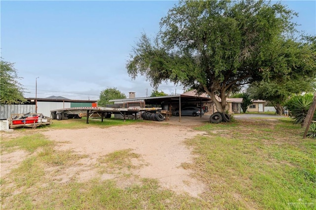 view of yard featuring a carport