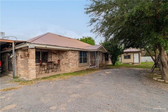 view of front of property with an outbuilding