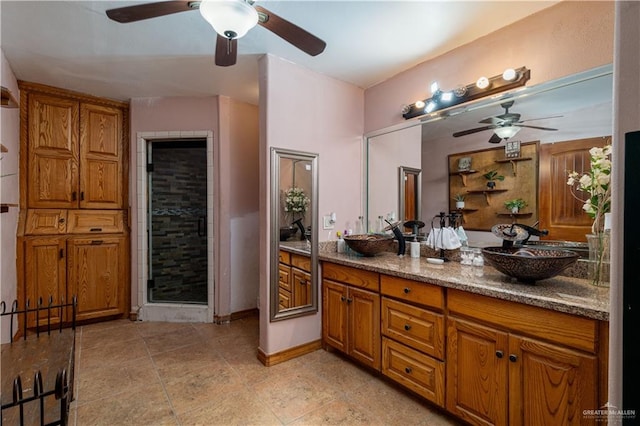 bathroom featuring vanity and a shower with shower door