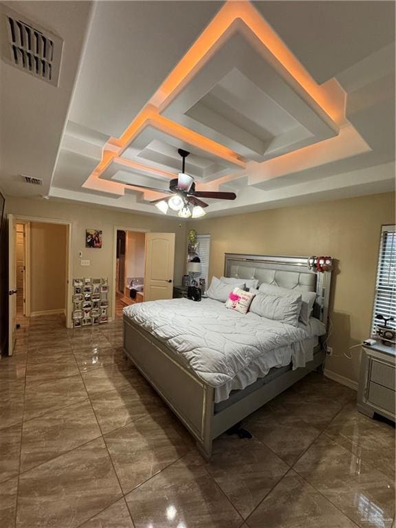 bedroom featuring ceiling fan, coffered ceiling, visible vents, baseboards, and marble finish floor