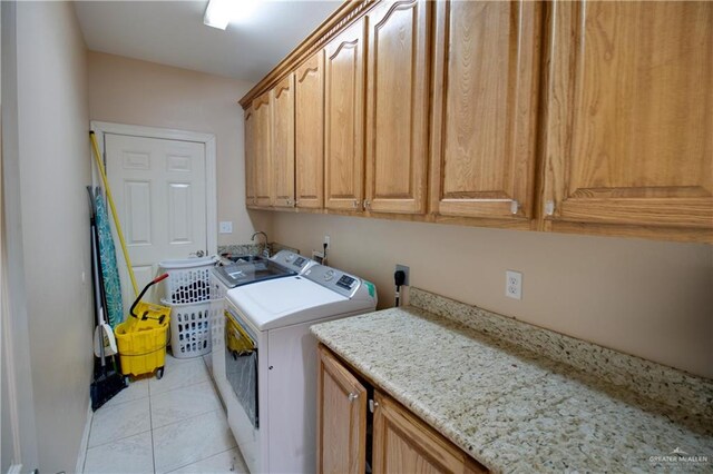 104 El Dora Rd, Alamo, TX 78516 - laundry area with cabinet space, independent washer and dryer, and light tile patterned flooring