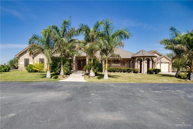 104 El Dora Rd, Alamo, TX 78516 - view of front of home featuring a front lawn