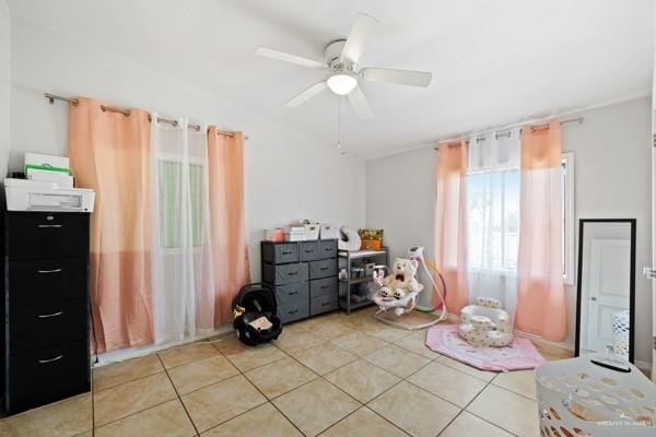 bedroom featuring light tile patterned floors and ceiling fan