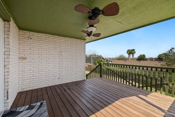 wooden deck featuring ceiling fan