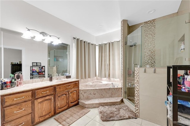 2103 W 30th St, Mission, TX 78574 - bathroom with a shower stall, tile patterned flooring, vanity, and a garden tub