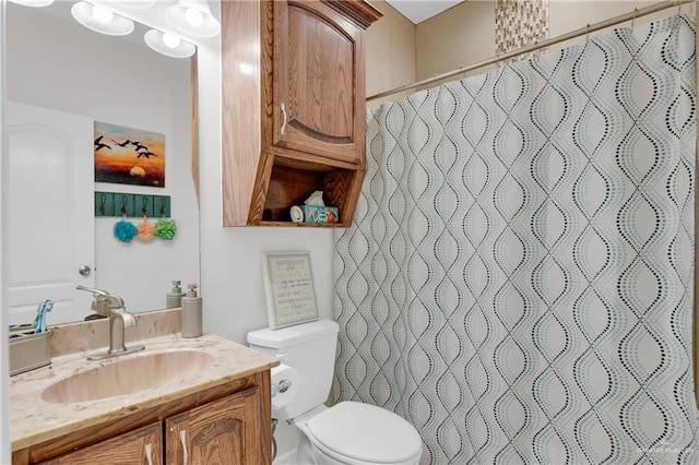 2103 W 30th St, Mission, TX 78574 - full bath with toilet, vanity, and a shower with shower curtain