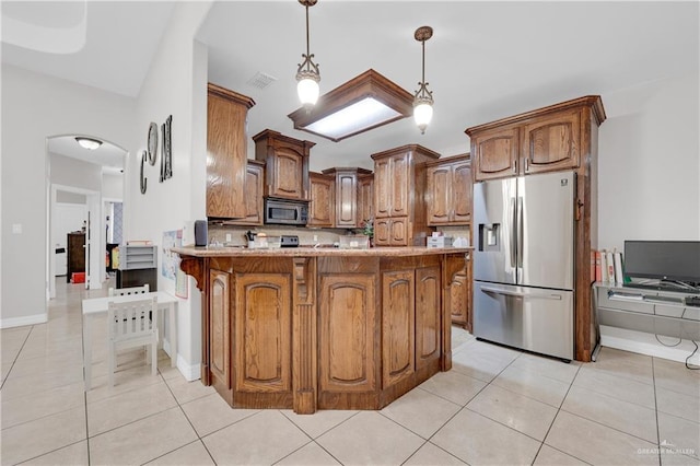 2103 W 30th St, Mission, TX 78574 - kitchen with stainless steel appliances, light tile patterned floors, a peninsula, and light countertops