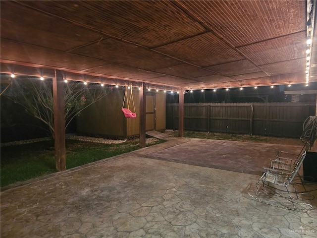 2103 W 30th St, Mission, TX 78574 - view of patio featuring fence and an outbuilding