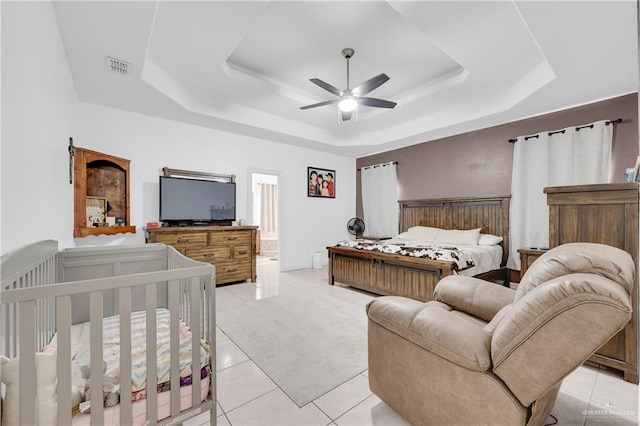 2103 W 30th St, Mission, TX 78574 - bedroom featuring a raised ceiling, a ceiling fan, and light tile patterned floors