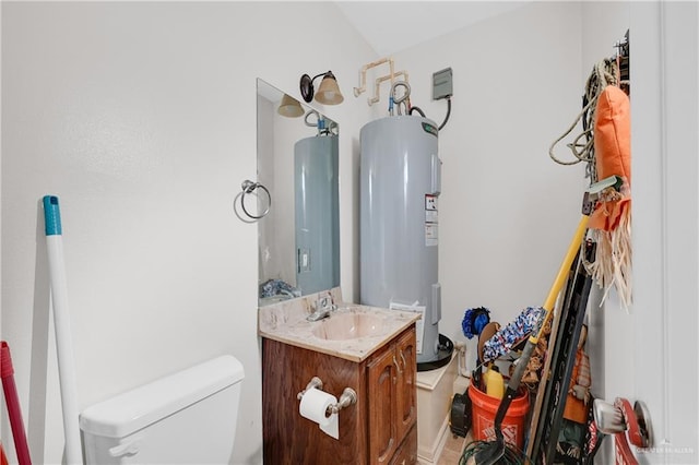 2103 W 30th St, Mission, TX 78574 - bathroom with water heater, toilet, and vanity