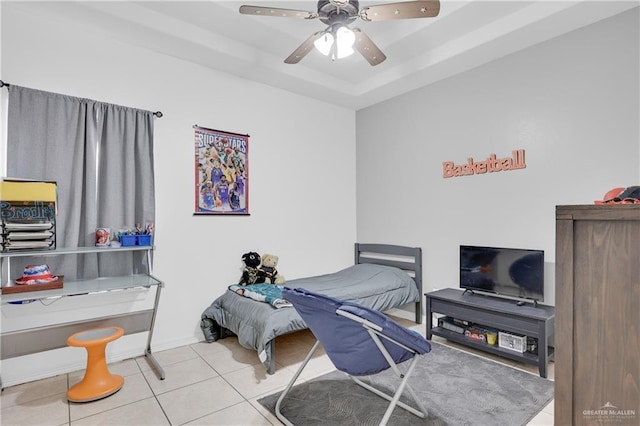 2103 W 30th St, Mission, TX 78574 - bedroom featuring tile patterned flooring, a raised ceiling, and a ceiling fan