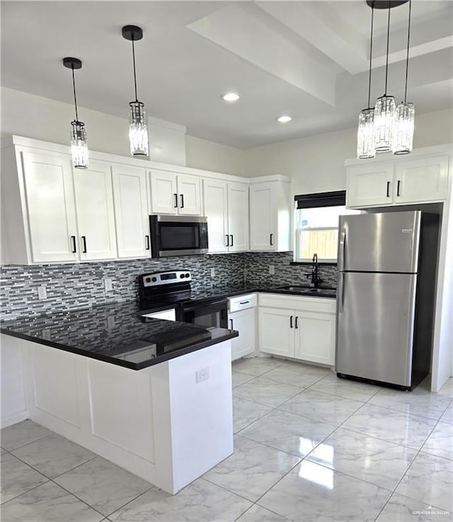 kitchen featuring decorative backsplash, white cabinetry, pendant lighting, and stainless steel appliances