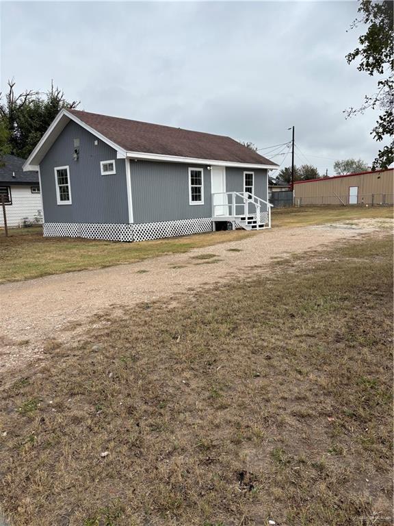 back of house with a yard