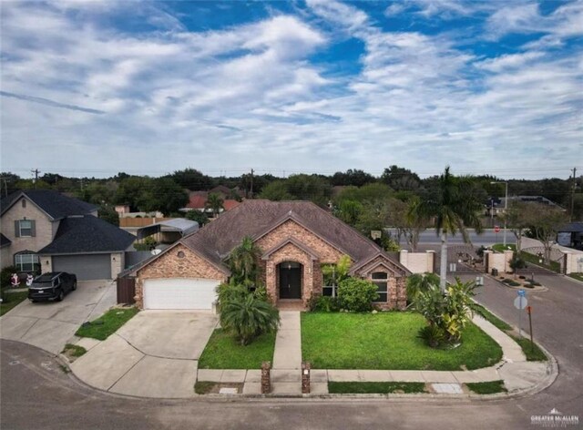 view of front of property with a garage and a front yard