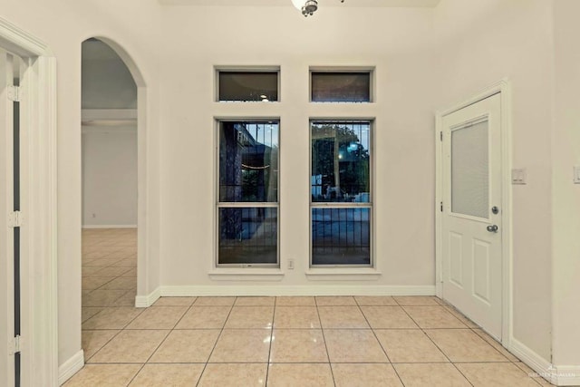 entryway with light tile patterned floors