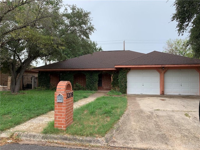 ranch-style house with a garage and a front lawn