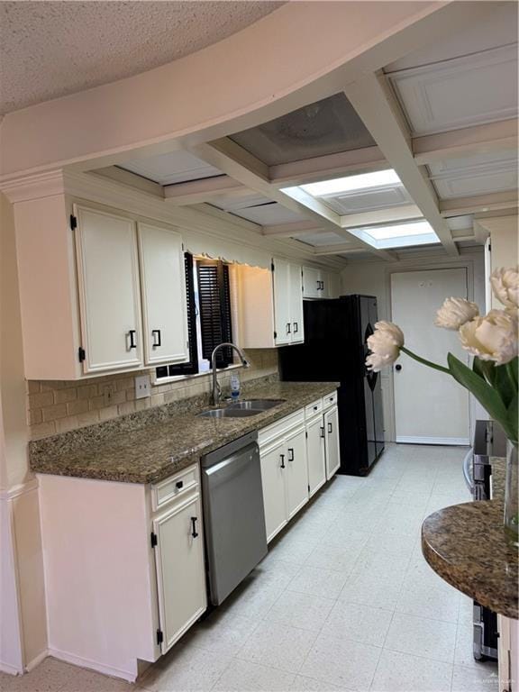 kitchen with white cabinetry, sink, dishwasher, and black fridge