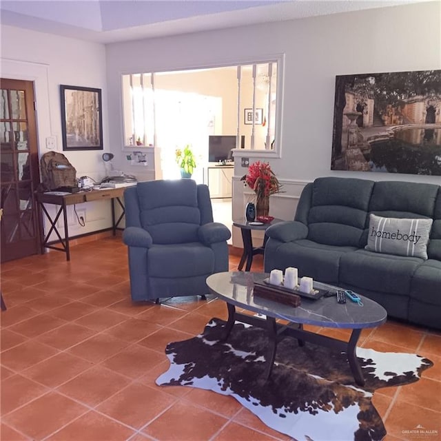 living room with tile patterned flooring