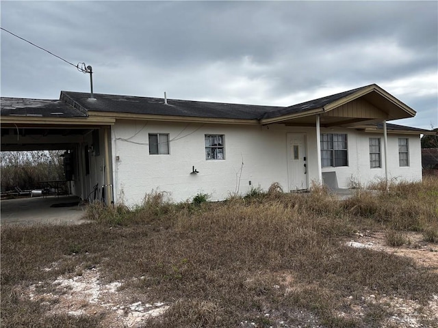 view of front of property featuring concrete block siding