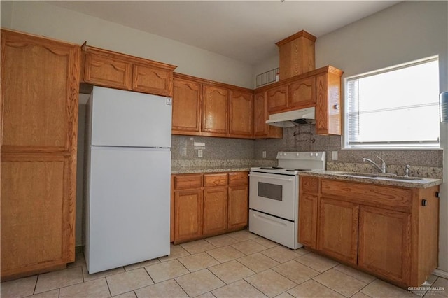 kitchen featuring tasteful backsplash, sink, white appliances, and light tile patterned flooring