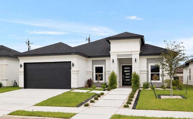 prairie-style home featuring a front yard and a garage