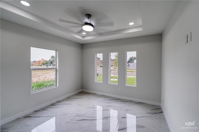 spare room featuring recessed lighting, baseboards, and a healthy amount of sunlight