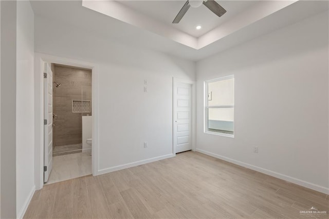 unfurnished room with baseboards and light wood-style flooring