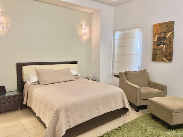 bedroom with light tile patterned floors