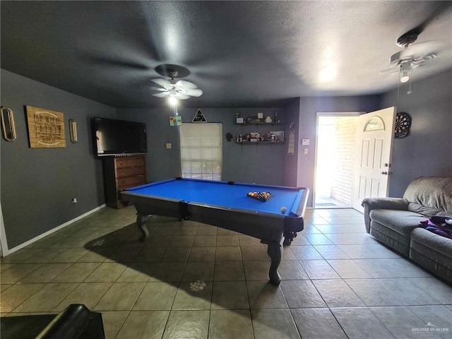 recreation room with tile patterned floors, ceiling fan, a textured ceiling, and billiards