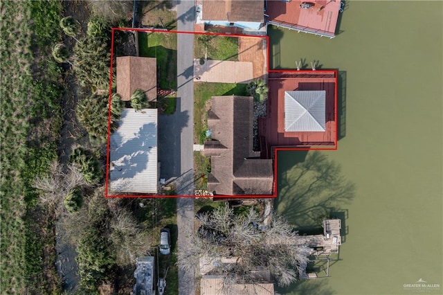 birds eye view of property featuring a water view