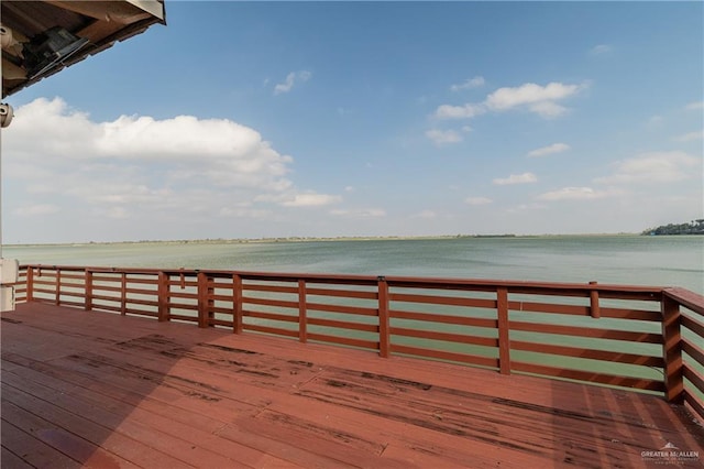 wooden deck with a water view