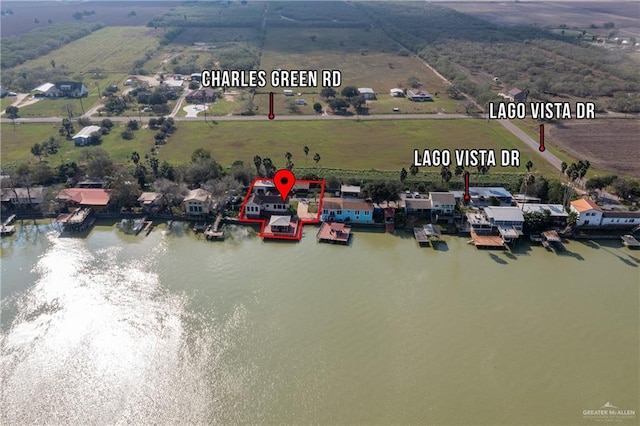 birds eye view of property with a water view