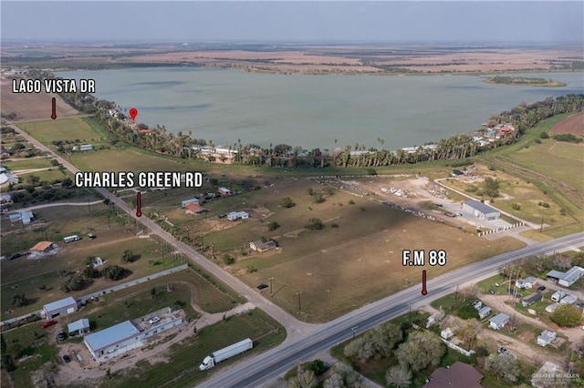 bird's eye view with a water view and a rural view