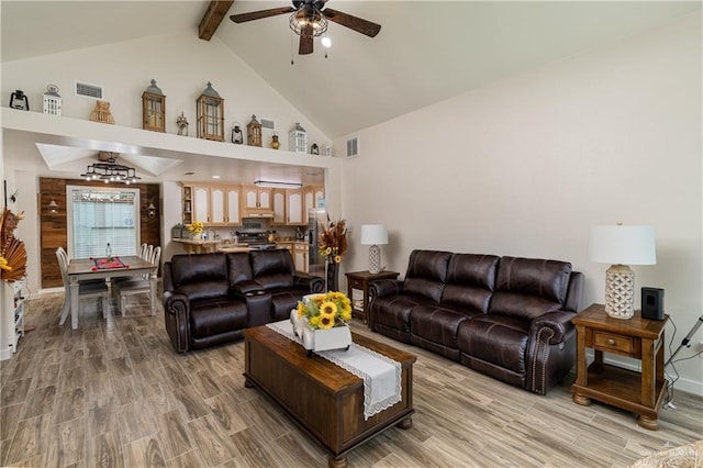 living room featuring ceiling fan, light hardwood / wood-style flooring, beamed ceiling, and high vaulted ceiling