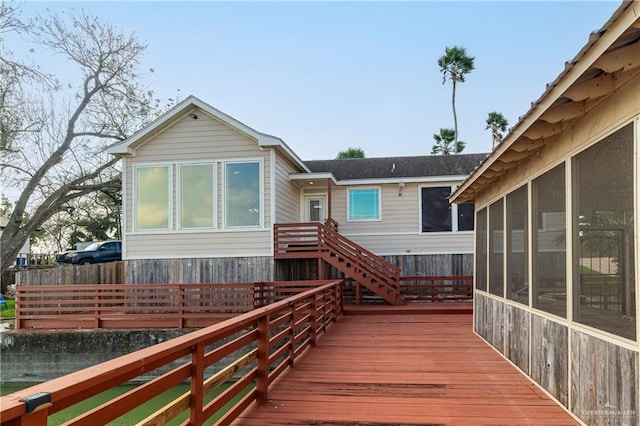 deck with a sunroom