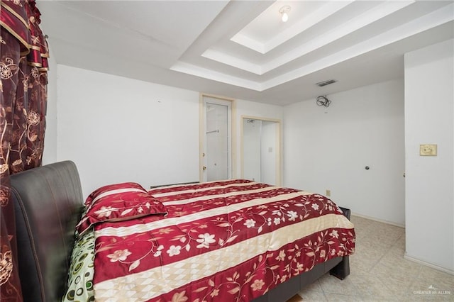 bedroom with a raised ceiling