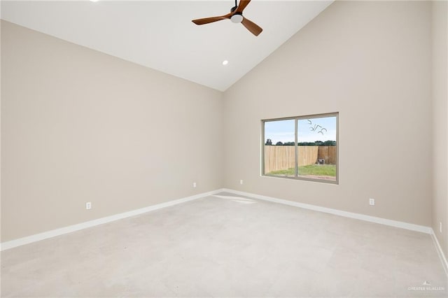 carpeted empty room with ceiling fan and high vaulted ceiling