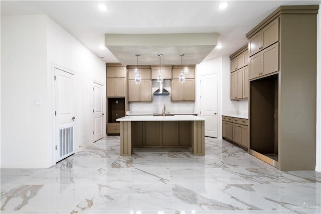 303 N 31st St, Hidalgo, TX 78557 - kitchen with wall chimney exhaust hood, a sink, light marble finish floors, decorative backsplash, and recessed lighting